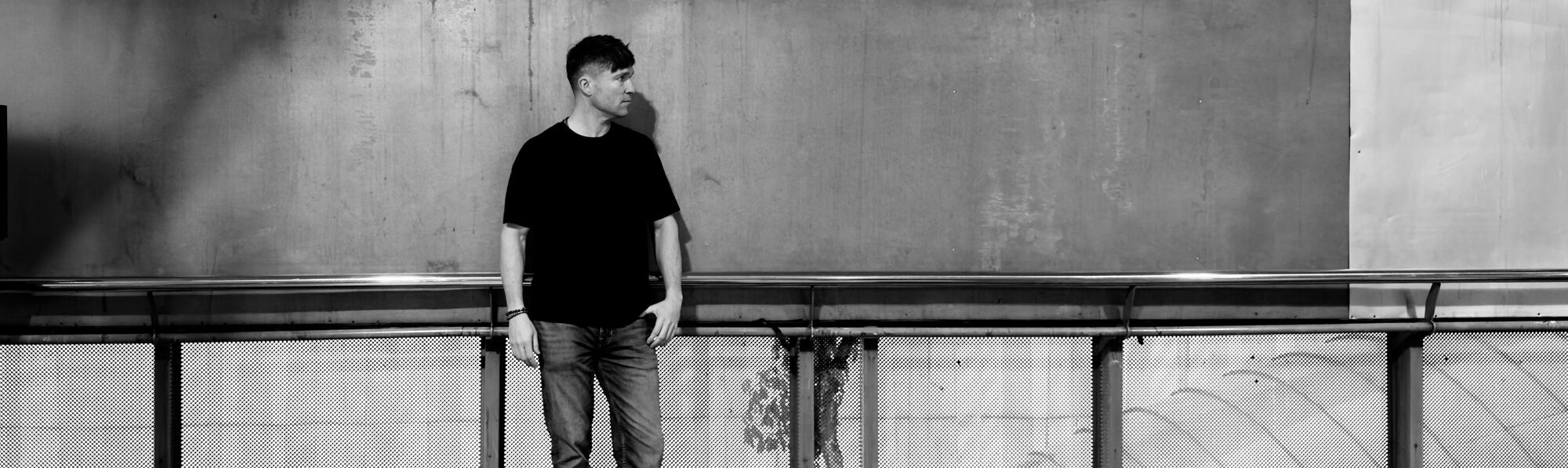 Reuben Lowe, founder of Mindful Creation, photographed in black and white on a Melbourne street
